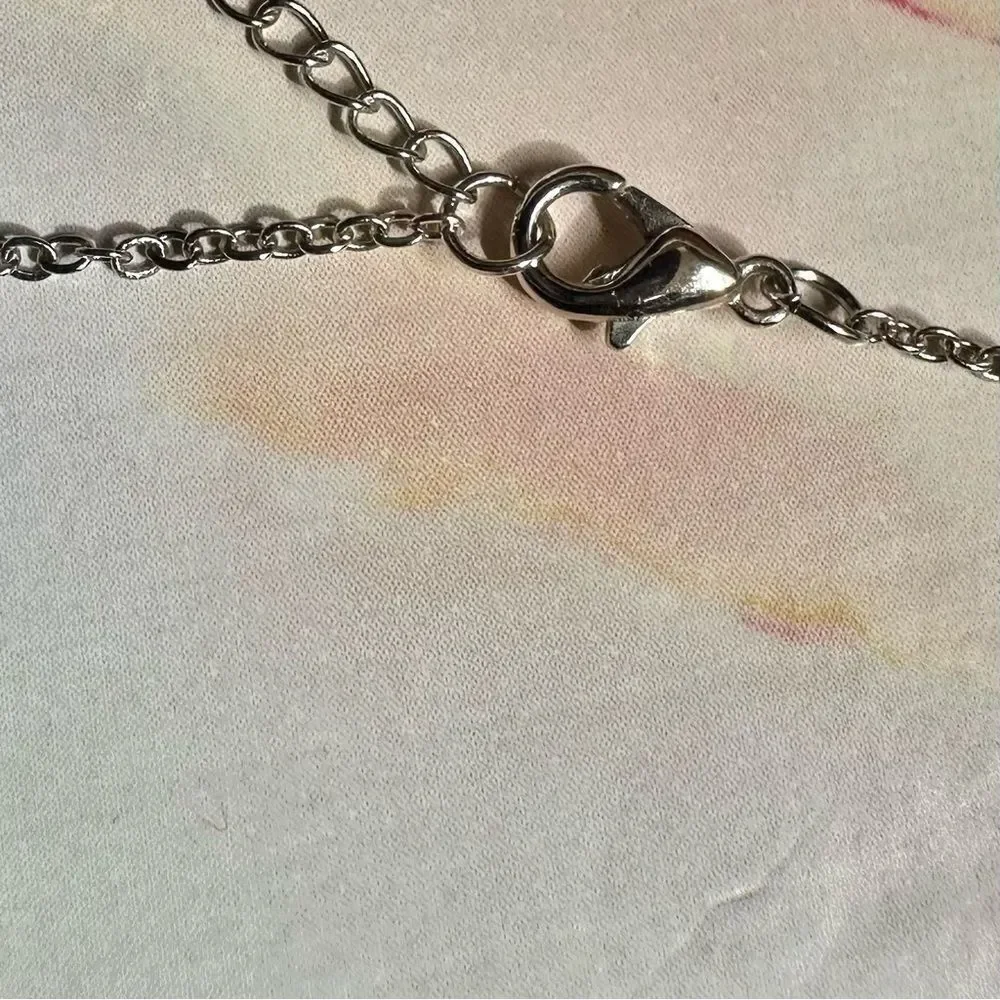 Silver tone rose pendant necklace